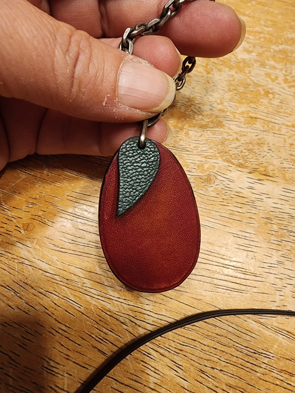 vintage Hermès leather plum fruit bag charm and keychain